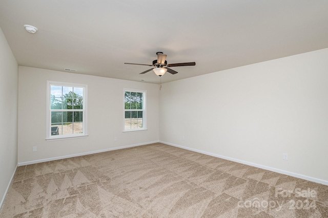 carpeted empty room with ceiling fan