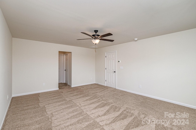 empty room with carpet flooring and ceiling fan