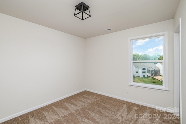 view of carpeted spare room