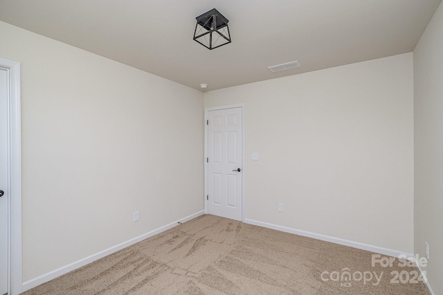 spare room featuring carpet flooring