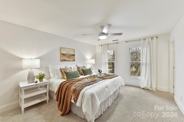 carpeted bedroom with ceiling fan