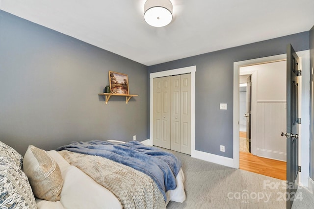 carpeted bedroom with a closet