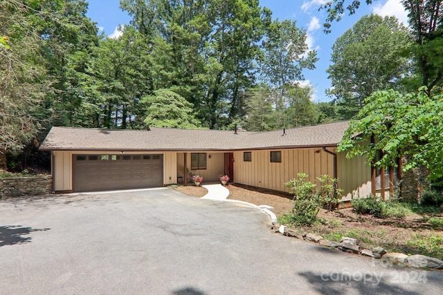 ranch-style house featuring a garage