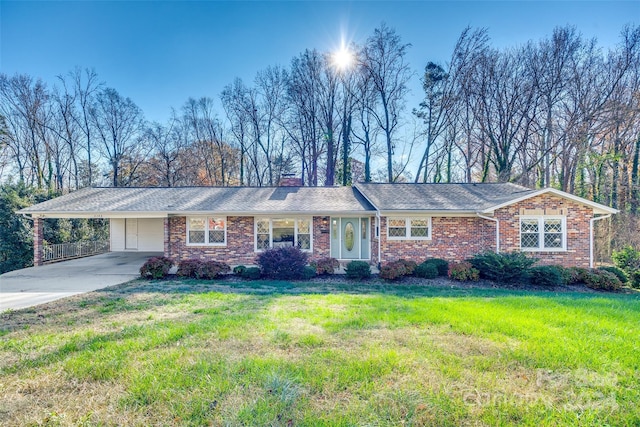 single story home featuring a carport and a front yard