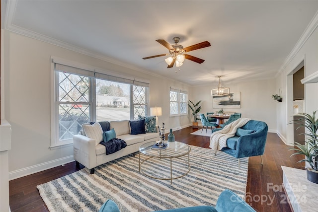 living room featuring dark hardwood / wood-style flooring, ceiling fan, and crown molding