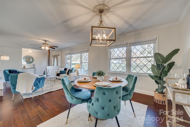 dining space with ceiling fan with notable chandelier, dark hardwood / wood-style floors, and ornamental molding