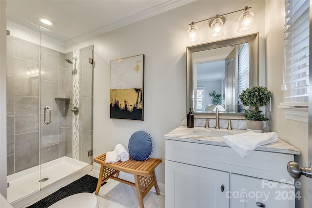 bathroom featuring crown molding, a shower with door, and vanity