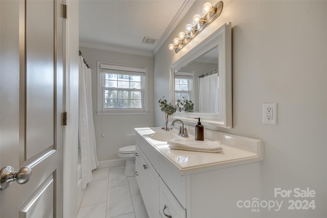 bathroom featuring vanity, toilet, and crown molding