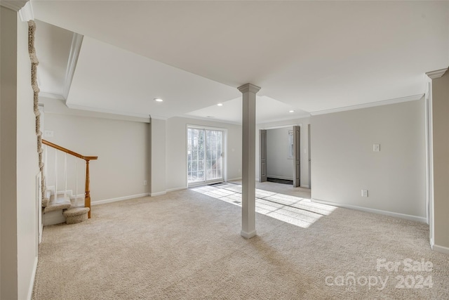 basement featuring light colored carpet and ornamental molding