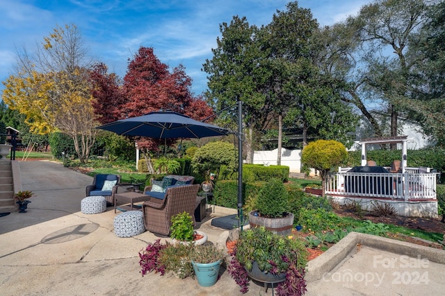 view of yard with an outdoor living space and a patio