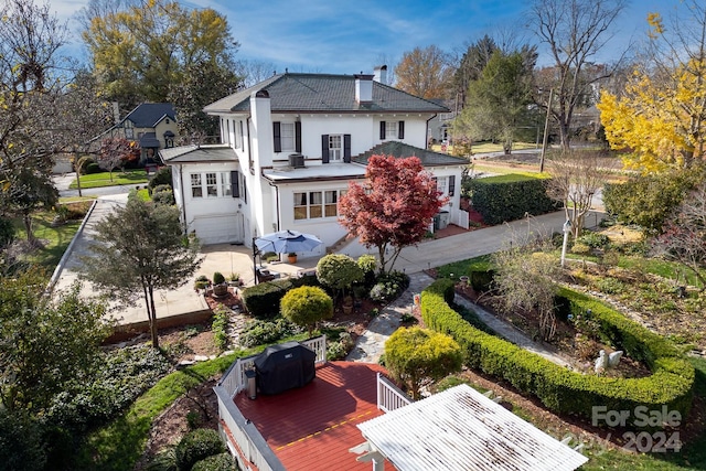 back of house featuring a garage