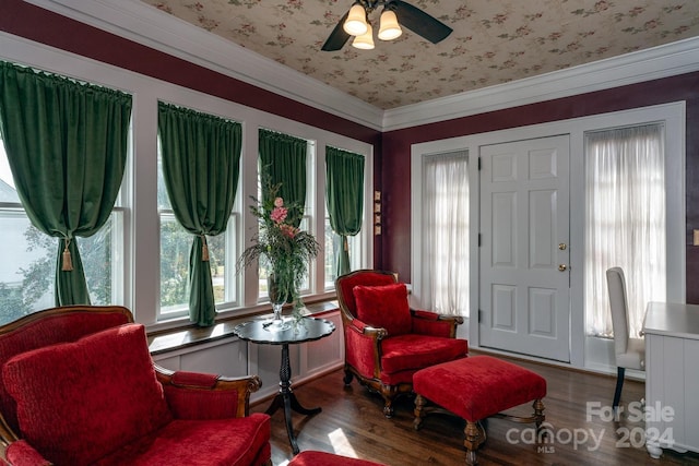 sitting room featuring ceiling fan, hardwood / wood-style floors, and crown molding