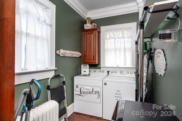 laundry room with washing machine and clothes dryer, crown molding, cabinets, and dark wood-type flooring