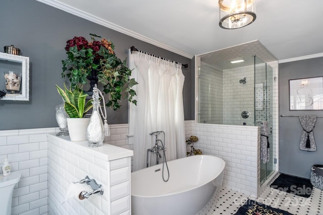 bathroom featuring shower with separate bathtub, tile patterned floors, tile walls, and crown molding