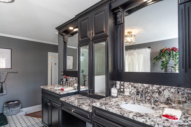 bathroom featuring vanity and ornamental molding