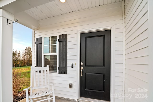 property entrance with a porch