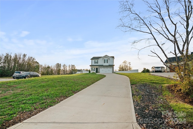 view of front of property with a front lawn and a garage