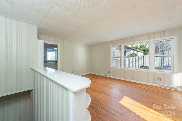 interior space with wood-type flooring and a wealth of natural light