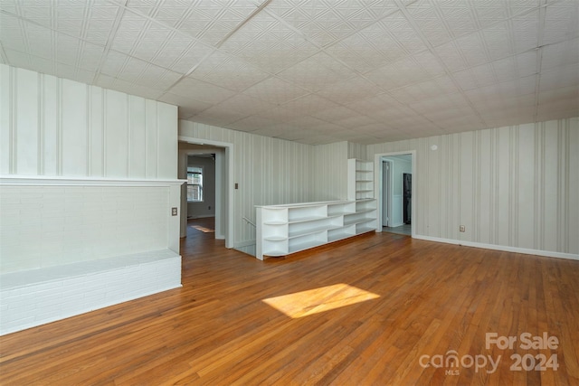 unfurnished living room with hardwood / wood-style floors