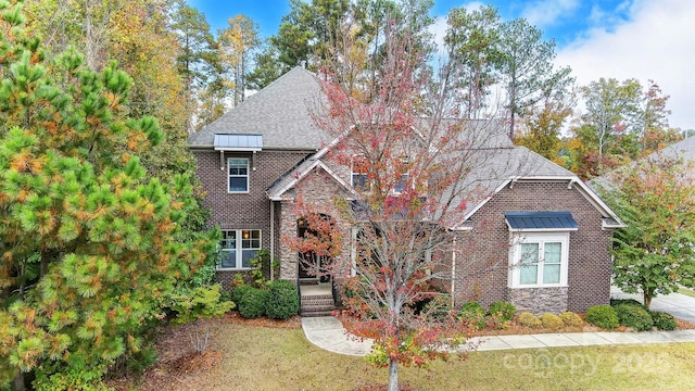 view of front of home with a front yard