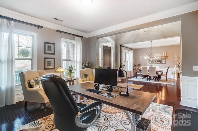 office space with ornamental molding and dark wood-type flooring