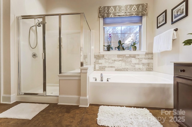 bathroom with tile patterned floors, separate shower and tub, and vanity