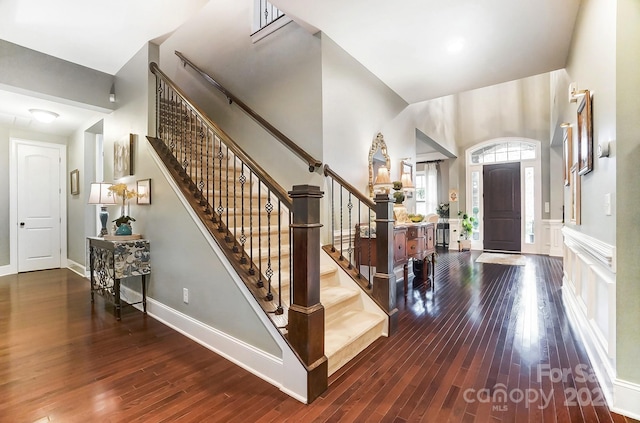 foyer entrance featuring dark hardwood / wood-style floors