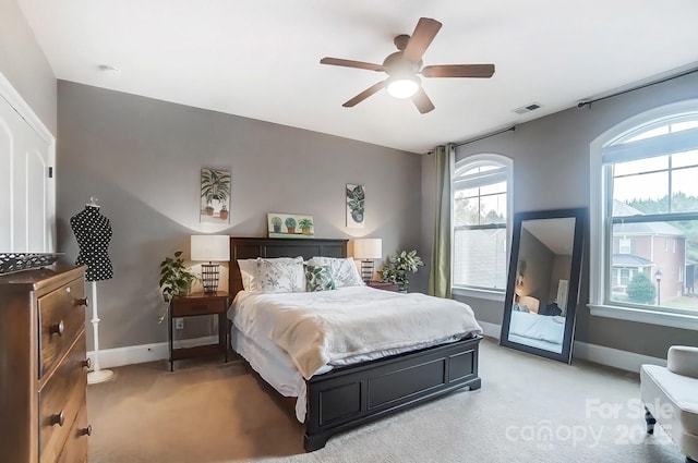 carpeted bedroom featuring ceiling fan