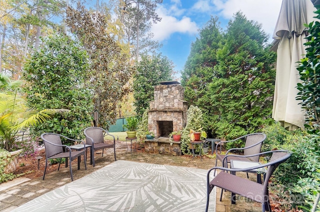 view of patio / terrace with an outdoor stone fireplace