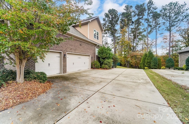 view of side of home with a garage