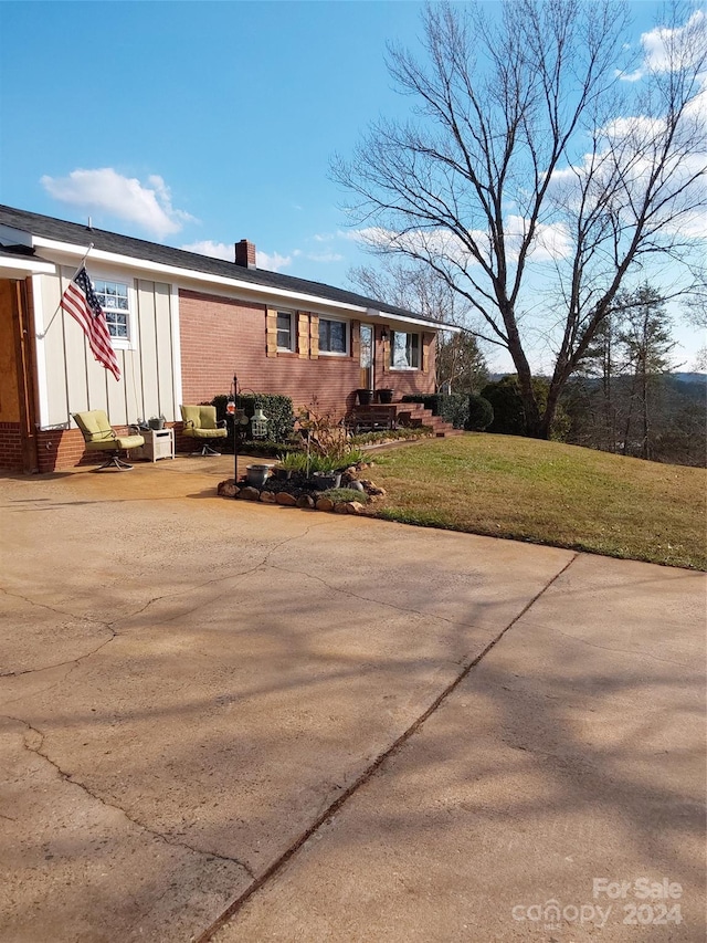 364 Moriah Church Rd, Casar, NC 28020 - view of front of home featuring a chimney, brick siding, a front yard, entry steps, and board and batten siding
