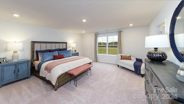 bedroom featuring light carpet