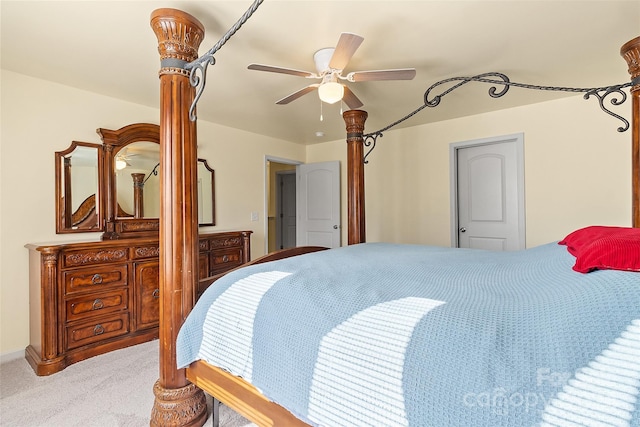 bedroom with ceiling fan and light carpet