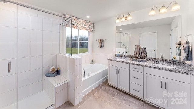 bathroom with vanity and plus walk in shower