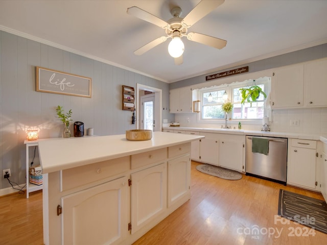 kitchen featuring dishwasher, a center island, decorative backsplash, ornamental molding, and light hardwood / wood-style floors