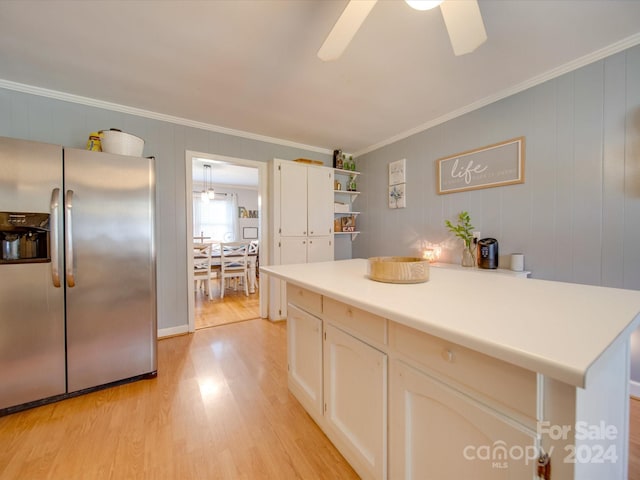 kitchen featuring crown molding, stainless steel refrigerator with ice dispenser, light hardwood / wood-style flooring, ceiling fan, and white cabinetry