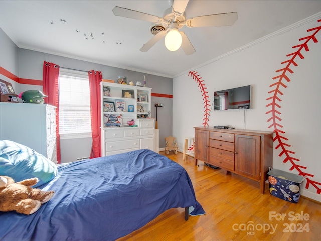 bedroom featuring ceiling fan, light wood-type flooring, and ornamental molding