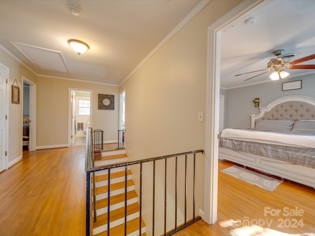 bedroom with ceiling fan, hardwood / wood-style floors, and crown molding