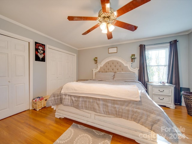 bedroom with light wood-type flooring, ceiling fan, and crown molding