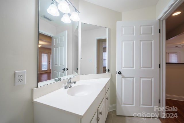 bathroom featuring vanity and hardwood / wood-style flooring