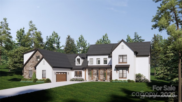 view of front of property featuring a front lawn, driveway, and an attached garage