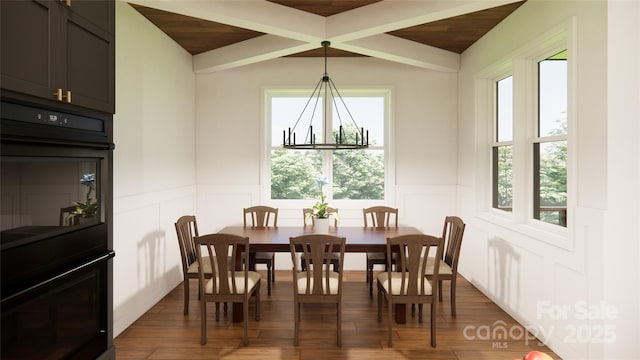 dining space featuring dark wood-style floors, wood ceiling, beamed ceiling, and a wainscoted wall