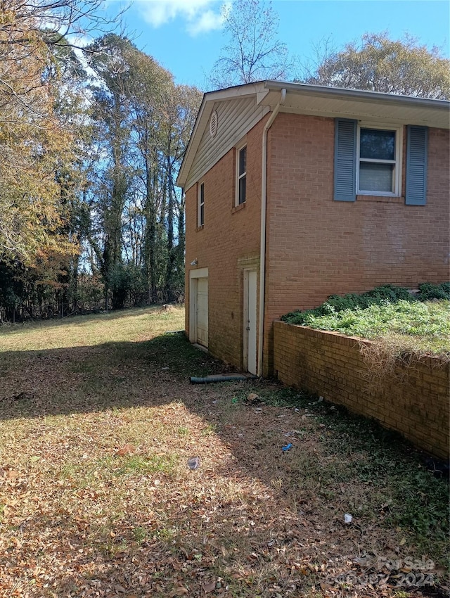 view of side of home featuring a garage