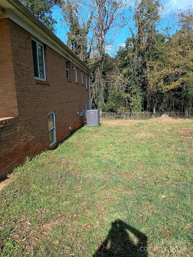 view of yard with central air condition unit