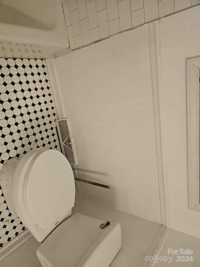 bathroom with tile patterned floors and toilet