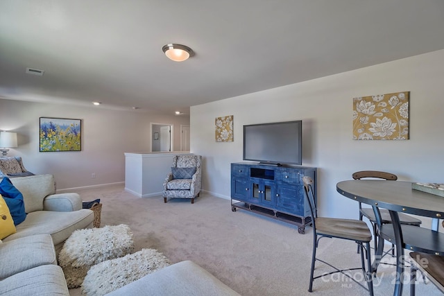 living room featuring light colored carpet