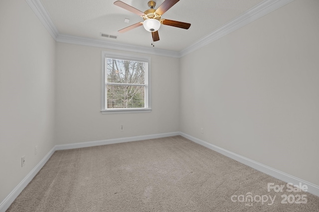 carpeted empty room with crown molding and ceiling fan