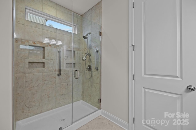 bathroom featuring tile patterned flooring and walk in shower