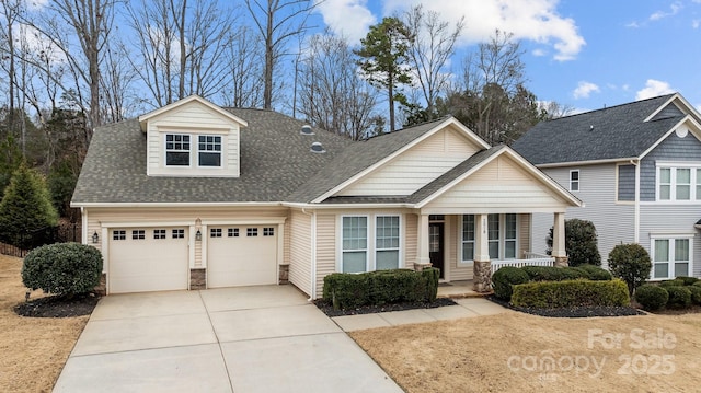 view of front of house with covered porch and a garage