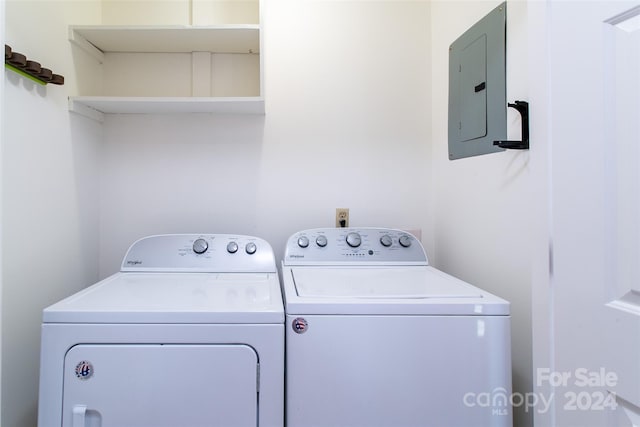 laundry area with separate washer and dryer and electric panel